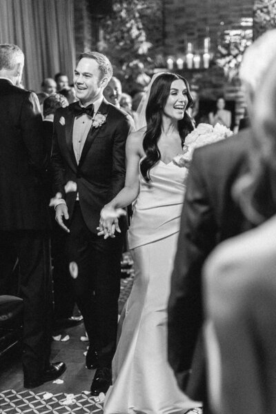 bride and groom walking back down aisle in Chicago wedding