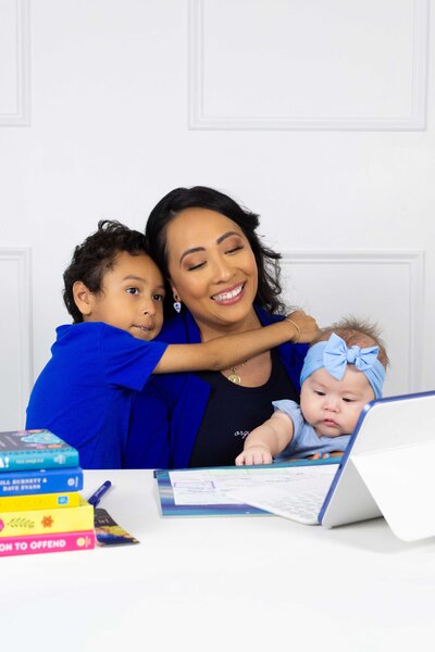 Virtual career coach balancing work and motherhood while working in her office, representing HR Mami Career Coaching.