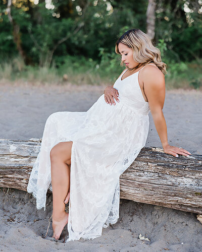 mom in white dress for maternity photo session