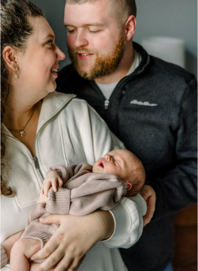 Couple holding newborn