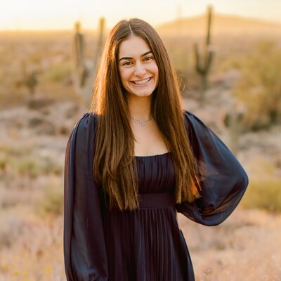 ASU graduate posing in the north scottsdale desert for her senior photos