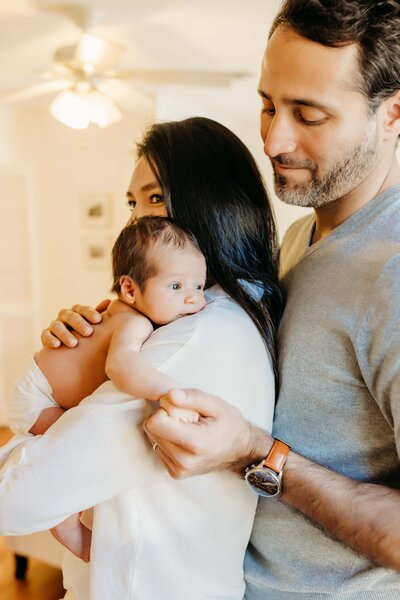 Newborn baby wrapped in blue for his photo session
