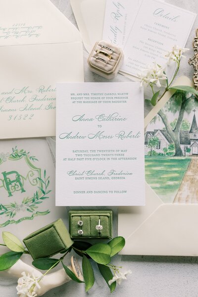 a wedding invitation with green text printed in beautiful typography