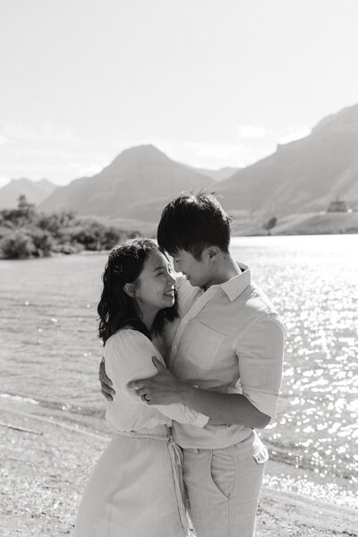 couple hugging in front of waterton lake