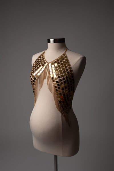 Bold gold disc necklace styled for maternity photos – studio wardrobe accessory from Hello Photography in Austin
