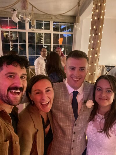 Amy & Nick posing with couple