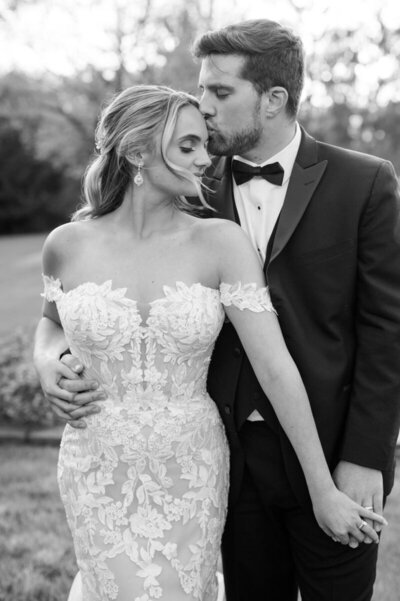 Bride and groom kissing on wedding day, taken by Cincinnati Wedding Photographer, Courtney Rudicel
