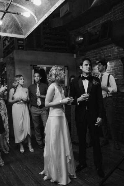 Kellen and Paul sharing a toast during their wedding reception in New York City.