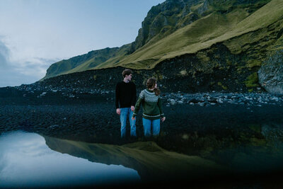 couple on black sand beach Iceland