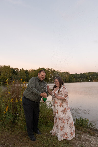 Couple pops sparkling water at sunset to celebrate engagement