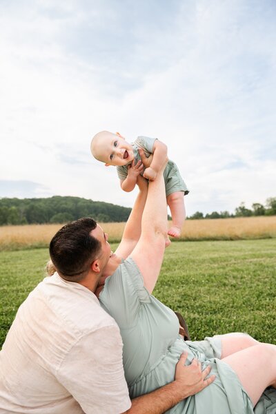 mom holding her daughter in a purple lavender field at whitehall maryland