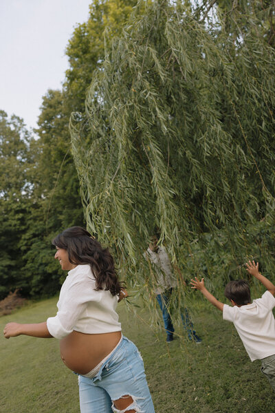 Mom zipping up daughters wedding dress 
