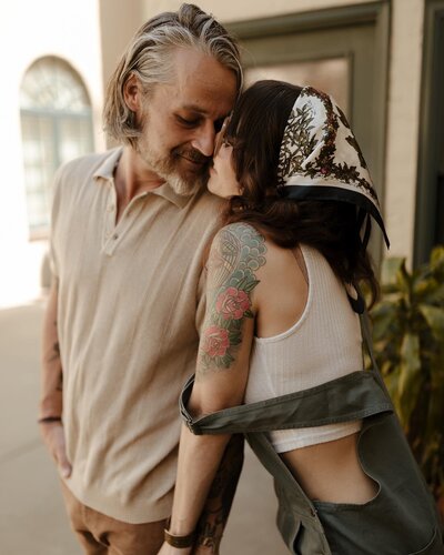 Intimate at-home couple's session capturing a tender kiss between partners