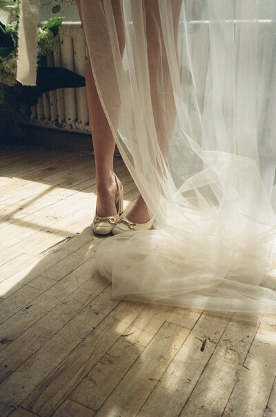 bride in heels and a veil