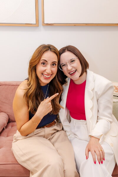 Two women posing for Camera
