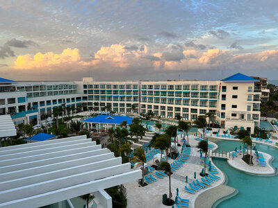 Beachfront resort with a stunning pool, perfect for hosting unforgettable destination weddings by the sea.