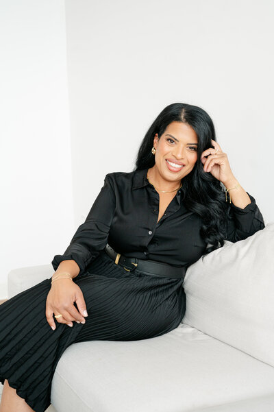 Photo of woman on couch in black and gold CT Wedding Photographer