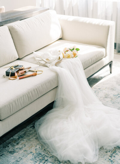 wedding day details laying on a couch