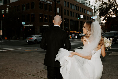 bride and groom wedding photos walking downtown san diego