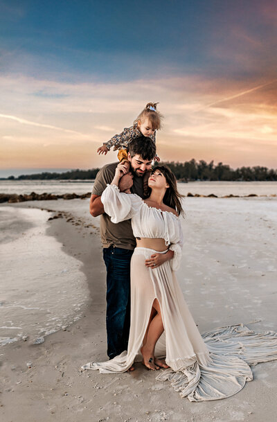 Family and Maternity Photographer, Family of three standing next to the ocean