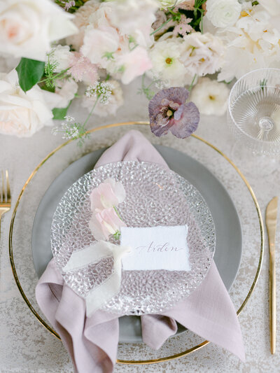 Handmade paper place card with calligraphy and silk ribbon for wedding at The Wheatleigh Hotel in The Berkshires, Massachusetts