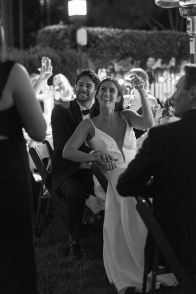 bride and groom making a toast  during their reception at the riviera mansion in santa barbara 