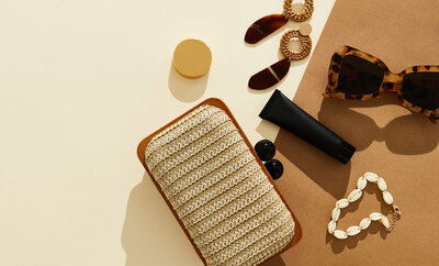 rattan purse and gold accessories