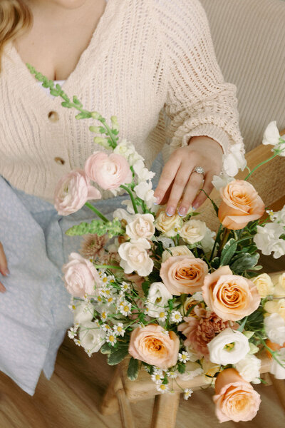 Wedding planner, Zelie & Co., fixing a floral arrangement