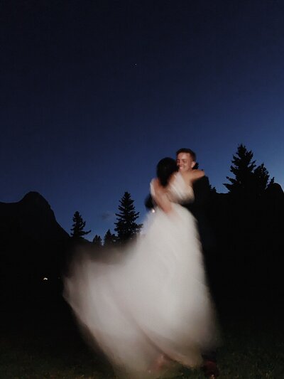 couple spinning in the dark night