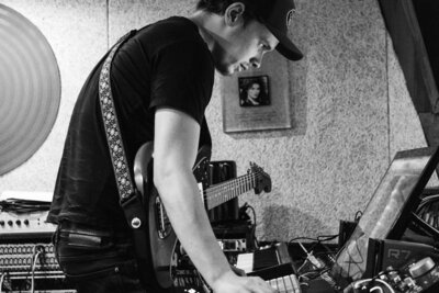 Brand photo headshot of producer guitarist engineer Will Schollar