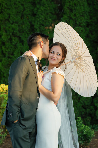 bride and groom holding hands while their bridal party is standing around them