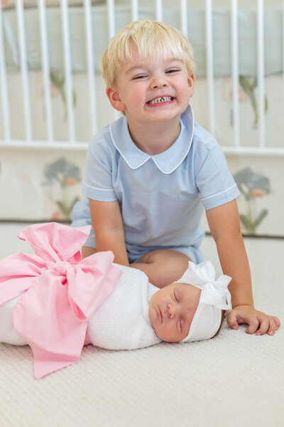 Baby in white embroidered onsie