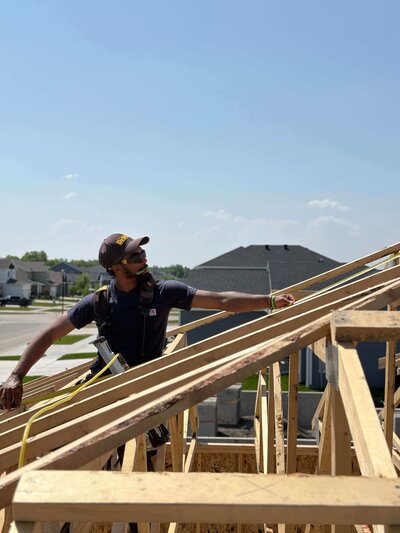 Owner of Tailored Builds framing a roof in Fargo, ND