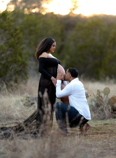 maternity photos of a couple in studio and outside near a creek