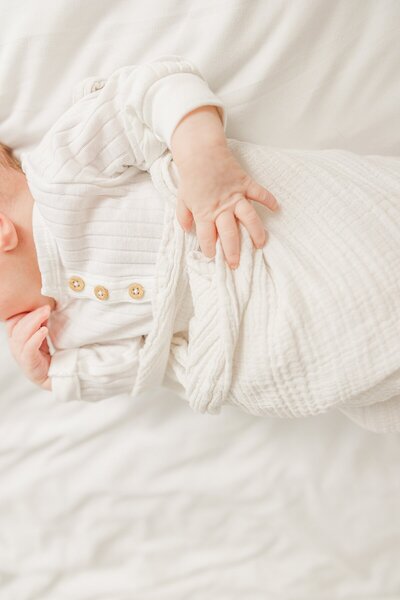 mother kisses son during family photo session with Sara Sniderman Photography in Natick Massachusetts