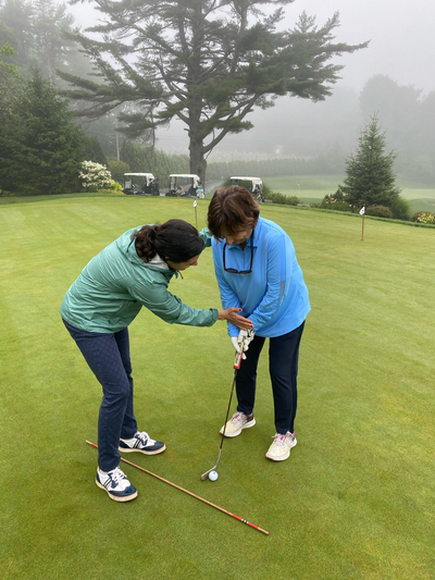 Renee O’Higgins, PGA and LPGA golf instructor giving a putting lesson at Quail West Golf and Country Club, Naples, Florida.