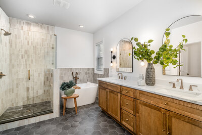 Steph Wagner Wilmington Realtor for Jacie and Co looking in mirror in modern Wilmington house for sale.