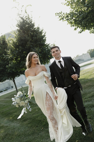 bride holding her hand on hip and smiling