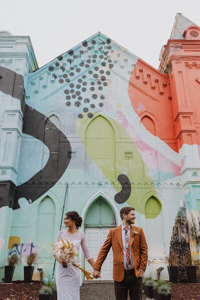 Couple poses in front of Culture House wedding Venue in DC