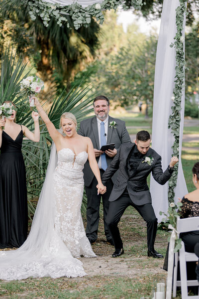 bride and groom dance on porch for Mississippi wedding photographer