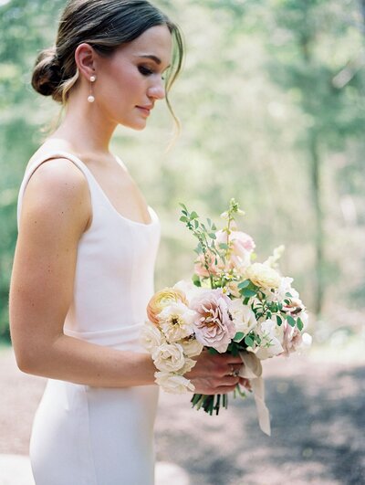 Petite organic bridal bouquet with chic silk white dress