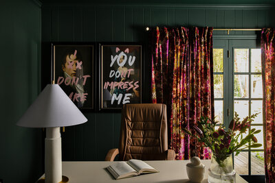 a bed with calming green and neutral bedding