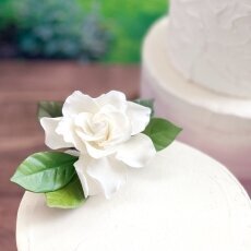 sugar flower cascade with white and gold open roses