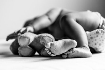 baby toes aligned with plush toy feet | Meg Sivakumar Photography
