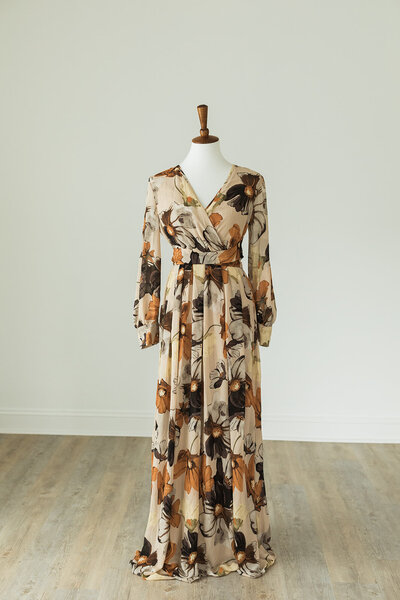 long sleeved floral dress with brown and burnt orange colors