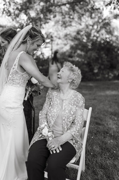 Bride and Grandma having a special moment during family portraits