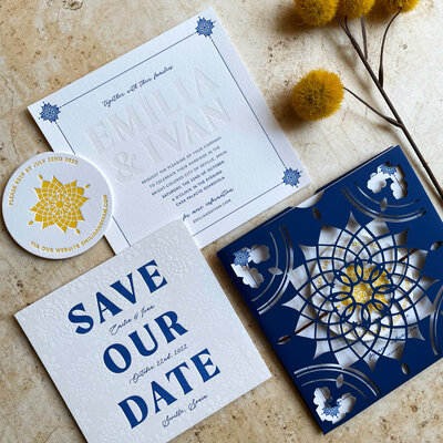 spanish tile inspired wedding invitations in blue and yellow