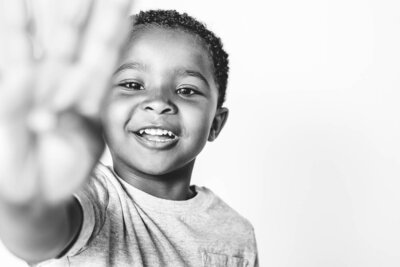 Side angle of happy boy looking at St. Petersburg photographer