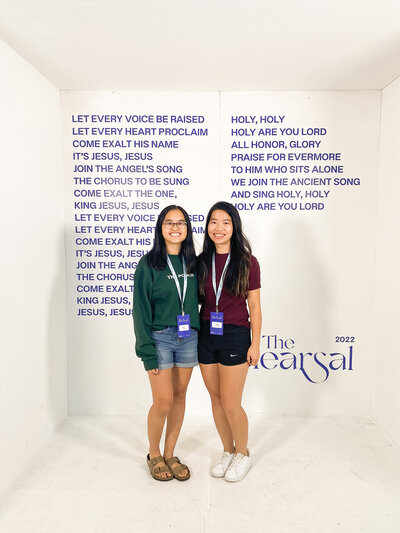 two girls standing and smiling