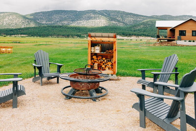 Outdoor fire pit with chairs at P-7 Base Camp in Potomac, MT